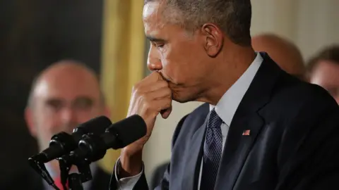 Getty Images Then US President Barack Obama breaks down at a press conference discussing Newtown shootings