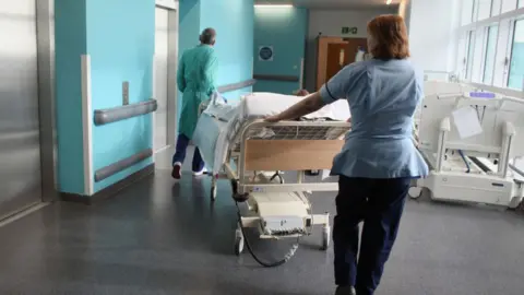 Getty Images Staff on a ward at the Queen Elizabeth Hospital in Birmingham