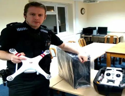 Warwickshire Police  PC Craig Purcell with seized drone