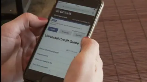 The universal credit guide website on a mobile phone