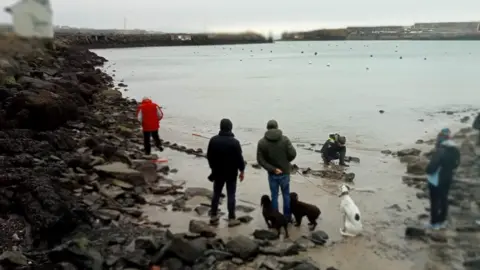 Gordy Wilton Boat being examined