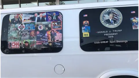 Reuters Mr Sayoc's van with pro-Trump images and an image reading 'CNN SUCKS dishonest media'