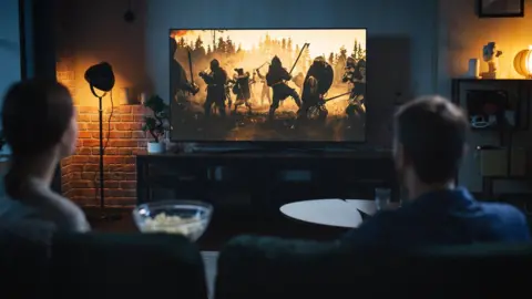 Getty Images A couple stream a film at home