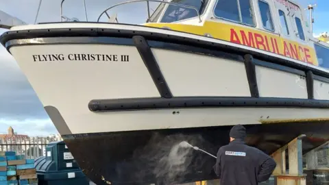 Boatworks Flying Christine III out of the water for routine maintenance
