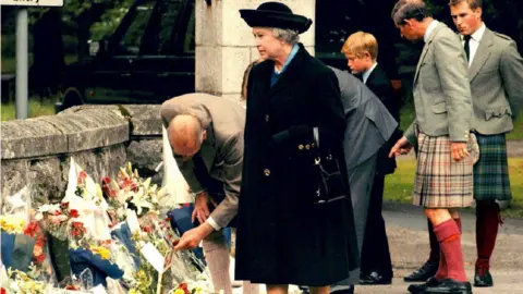 Mathieu Polak The Royal family looks at floral tributes left at Balmoral Castle for Princess Diana days after her death