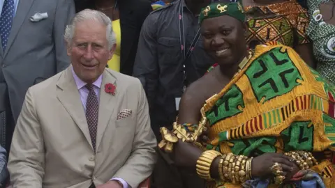 Getty Images Prince Charles, Prince of Wales tours a Cocoa Farm on November 4, 2018 in Kumasi, Ghana. The Prince was greeted by the Livelihoods and Climate Adviser for D.F.I.D. Ghana, Mr. Nicholas Baynham, the Chief of Kona, Nana Konadu Yiadom Kumanin IV and was accompanied by the farm owner, Mr. Agyin Brefo