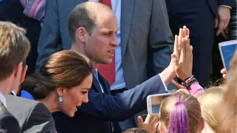 PA Prince William high fives a member of the crowd