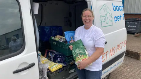 Luke Deal Tanya Rudkin loading the pet foodbank van