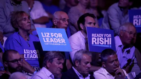 Reuters Supporters of Liz Truss and Rishi Sunak at a campaign hustings