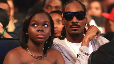 Getty Images Recording artist Snoop Dogg (R) and Cori Broadus attend the BET AWARDS '14 at Nokia Theatre L.A. LIVE on June 29, 2014 in Los Angeles, California