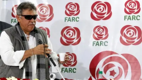 Reuters Jesus Santrich, a leader of Colombia;s former Marxist FARC rebels, gestures during a news conference in Bogota, Colombia November 16, 2017. Picture taken November 16, 2017.