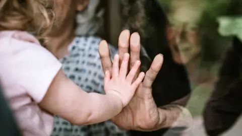 Getty Images visiting grandparents through window