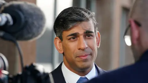 Reuters Prime Minister Rishi Sunak taking part in a media interview in Deganwy, Conwy, during a visit to north Wales on Friday.