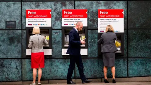 Getty Images People at cash machines