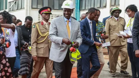 Getty Images President William Ruto and a delegation tour the newly commissioned Fertiplant fertilizer granulation factory in Nakuru. Fertiplant, a local fertilizer plant, is expected to address the fertilizer deficit in Kenya ahead of the planting season
