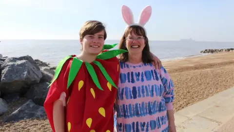 St Elizabeth Hospice People dressed in a strawberry outfit and a bunny costume for the Felixstowe dip
