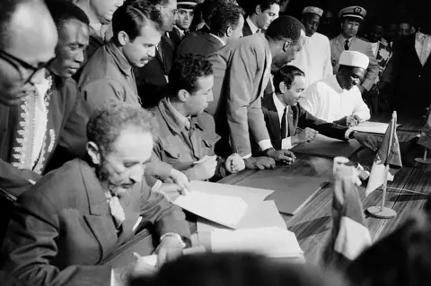 AFP Haile Selassie signing a document