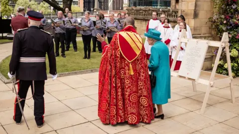 Simon Bray The Queen watching performance by Manchester Lesbian and Gay Chorus