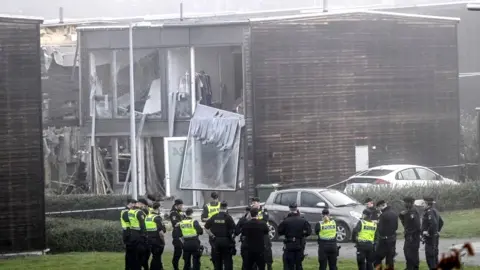 AFP A damaged building is seen after a powerful explosion near Uppsala. Photo: 28 September 2023