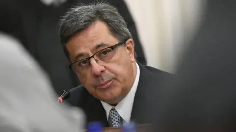 Getty Images Markus Jooste appearing before a parliamentary committee in 2018.