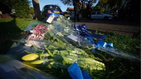 PA Media Floral tributes for Sir David Amess