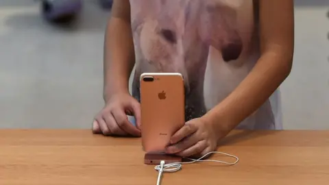 Getty Images Girl using a phone
