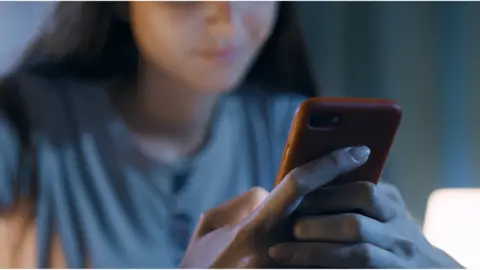 Woman holding mobile phone