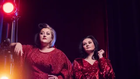 Drew Forsyth Kiri and Rachael on stage