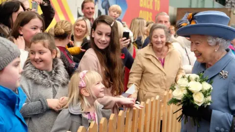 The Royal Family The Queen greeting people