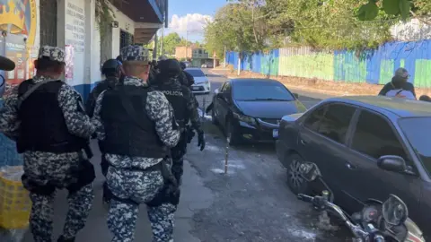 Police and soldiers patrol the streets