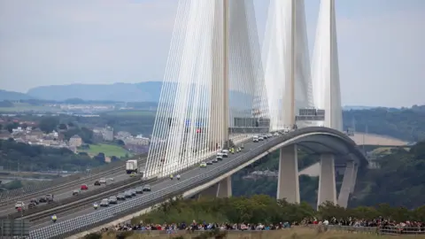 REUTERS/Phil Noble The hearse carrying the coffin of Queen Elizabeth crosses the Queensferry Crossing over the Firth of Forth