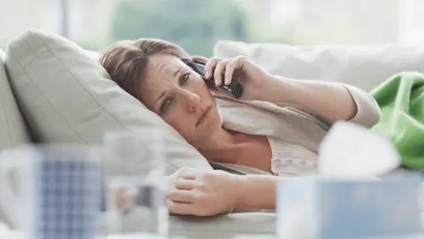 Getty Images Sick woman on the phone