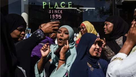 Getty Images People celebrate at a mosque called the Masjid at-Taqwa after the Eid al-Fitr prayer on June 4, 2019 in the Brooklyn borough of New York City