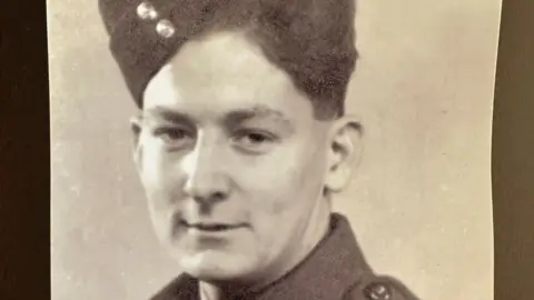 Family Handout A greyscale portrait of Alan McQuillin