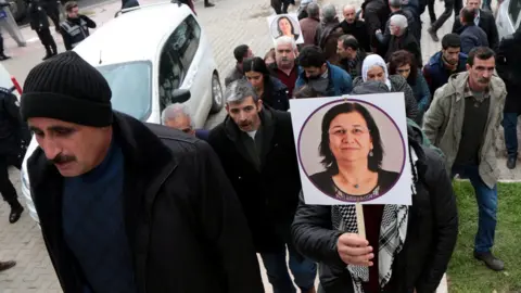 Reuters A supporter of pro-Kurdish Peoples" Democratic Party (HDP) holds a picture of jailed lawmaker Leyla Guven, during a demonstration in solidarity with her, in Diyarbakir, Turkey January 12, 2019