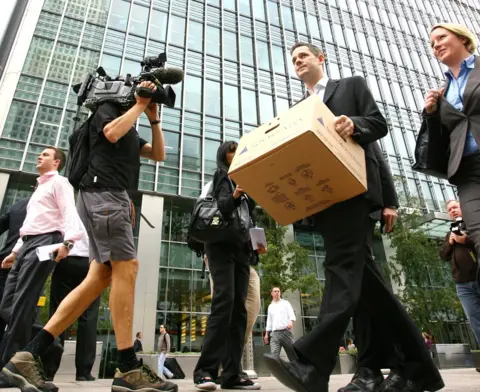 BEN STANSALL Lehman Brothers staff leaving the London HQ after the firm filed for bankruptcy