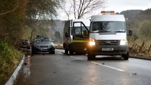 Getty Images Cars abandoned due to the flooding of the River Wye in Monmouth are being recovered on Wednesday