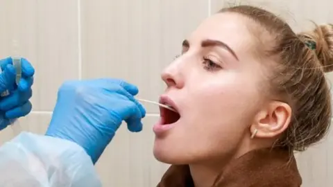 Getty Images Woman being tested