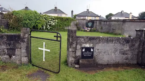 AFP/Getty Images The home was demolished but a shrine was later erected on the site