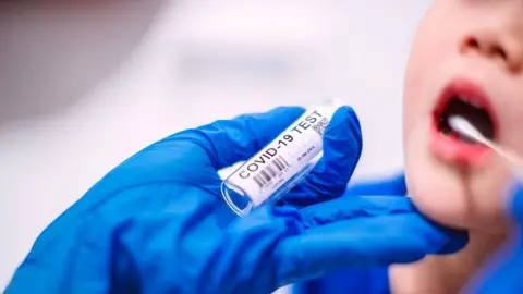 Getty Images Child being tested for coronavirus