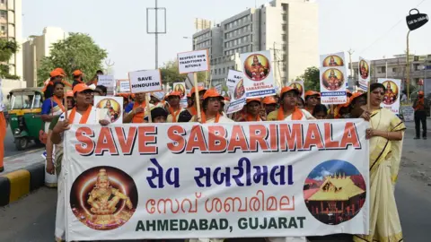 Getty Images Indian Ayaappa devotees participate in a peaceful protest rally against the Supreme Court decision to allow women of all ages to enter inside the Kerala's Sabarimala temple, in Naroda area of Ahmedabad on October 14, 2018