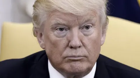 Getty Images President Donald Trump in the Oval Office