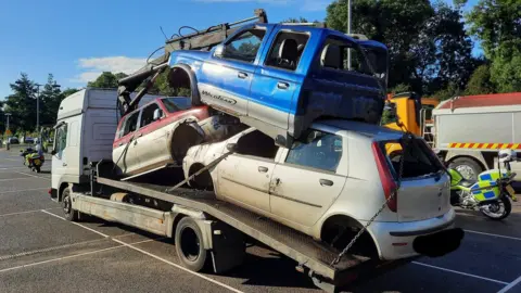 NSRAPT Cars on the back of a trailer