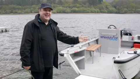 PA Media Peter Kay with the boat