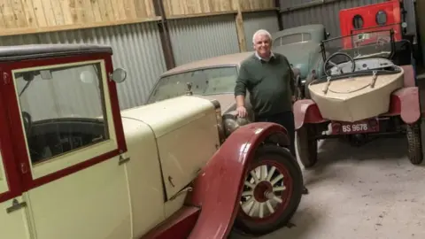 Hansons  Jim Ronan with one of the cars