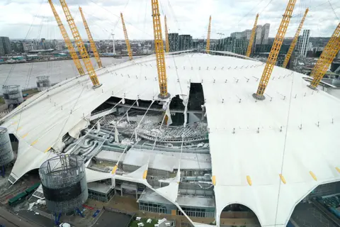 Reuters Damage to the roof of the O2 Arena in south east London, caused by Storm Eunice on 18 February 2022