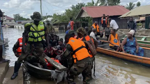 Thomas Naadi/BBC Navy rescuing residents after flooding