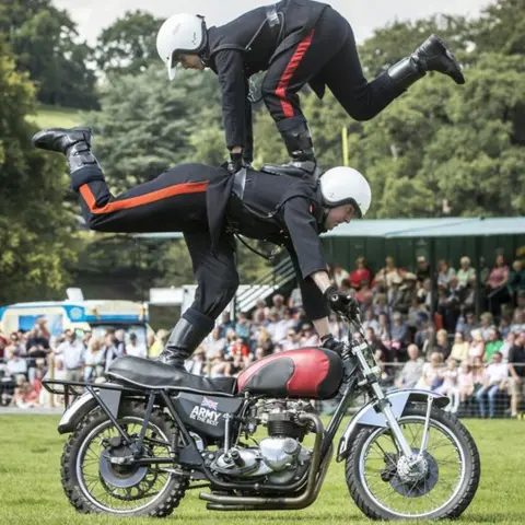 Getty Images White helmets perform stunts