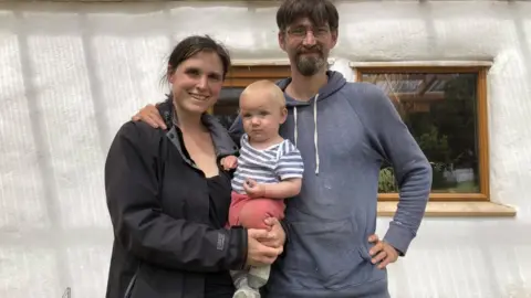 BBC Dr Thompson, her husband Chris and their baby
