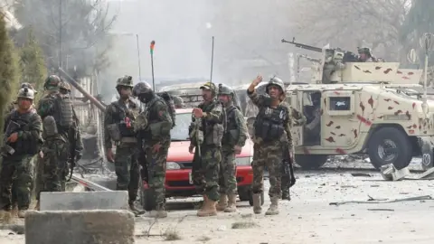 Reuters Afghan security officers at the scene of the attack in Jalalabad